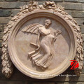 round carved stone relief with angel